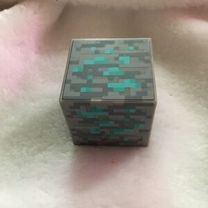 Pixelated Gray and Teal Cube